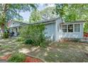 Charming home with a covered porch and lush landscaping, perfect for outdoor enjoyment at 4236 Florida Nw Ave, Atlanta, GA 30360