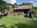 Expansive backyard featuring a well-maintained lawn, patio area, mature trees and is great for outdoor activities at 90 Cabriolet Trail, Mcdonough, GA 30253