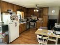 Functional kitchen equipped with essential appliances and ample cabinetry for storage at 90 Cabriolet Trl, Mcdonough, GA 30253