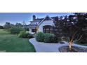 Charming home with well manicured landscaping and a curved walkway at 251 Merrell Rd, Carrollton, GA 30116