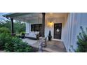 Inviting front porch with a swing and a cozy seating area at 251 Merrell Rd, Carrollton, GA 30116