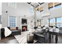 An elegant open-plan living room featuring high ceilings, a fireplace, and exquisite finishes at 50 Birch Road, Covington, GA 30014
