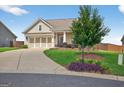 Attractive single-story home with a well-manicured lawn, three-car garage, and inviting front porch at 4160 Grandview Vista St, Cumming, GA 30028