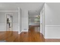 Bright entryway featuring hardwood floors and neutral paint, creating a welcoming and spacious atmosphere at 1048 Falls Brooke Dr, Conyers, GA 30094