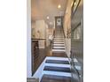Welcoming foyer showcasing modern design, sleek staircase, and an open-concept layout flowing into dining area at 4107 Township Pkwy # 69, Sandy Springs, GA 30342