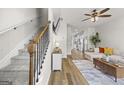 Bright living room featuring hardwood floors, a ceiling fan, and an open layout at 1004 Bayrose Cir, East Point, GA 30344