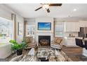 Inviting living space with a fireplace, contemporary furnishings, and an open floor plan at 179 Stanchion Dr, Union City, GA 30291