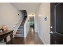 Entryway boasts hardwood floors and carpeted staircase at 3155 Tarian Way, Decatur, GA 30034
