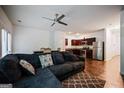 Open concept living room with hardwood floors and views of the kitchen at 3155 Tarian Way, Decatur, GA 30034