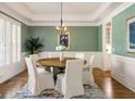 Inviting dining room with stylish decor, including a round table and elegant white chairs at 125 Franklin Pl, Atlanta, GA 30342
