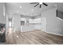 Open living space with modern design elements, featuring hardwood floors and seamless kitchen integration at 569 Middle Sw St, Atlanta, GA 30310