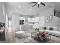 Bright, modern living room flowing into a sleek kitchen with island seating and stylish decor at 569 Middle Sw St, Atlanta, GA 30310