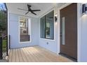 Inviting porch with ceiling fan, stylish lighting, and a modern front door, creating a welcoming entrance at 569 Middle Sw St, Atlanta, GA 30310