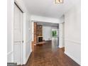 Inviting foyer with hardwood floors and a brick fireplace, leading to an open living space at 2917 Rockingham Nw Dr, Atlanta, GA 30327