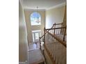 Bright foyer with high ceilings, large window and an elegant chandelier at 176 Fairoaks Cir, Stockbridge, GA 30281