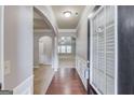 Home foyer showing hardwood floors, open spaces, and decorative molding at 2030 Beyers Landing Dr, Buford, GA 30519