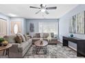 Spacious living room with ample seating, a stylish area rug, and contemporary accents for a cozy yet modern feel at 1694 Pheasant Dr, Atlanta, GA 30238