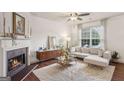 Inviting living room with fireplace, plush sofa, and modern decor, creating a cozy ambiance at 1911 Stancrest Nw Trce, Kennesaw, GA 30152