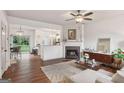 Open-concept living room with fireplace, adjacent to the kitchen and dining area at 1911 Stancrest Nw Trce, Kennesaw, GA 30152