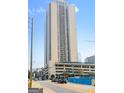 The condo building exterior is modern and sleek, with a view of city streets and ongoing construction at 1280 W Peachtreestreetsuffix=Street Nw # 808, Atlanta, GA 30309