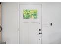 Close-up of a white door with glass window at 4020 Ester Sw Dr, Atlanta, GA 30331