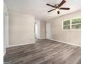 Spacious living area features durable wood-look floors, a ceiling fan, and a convenient layout at 114 Howell Dr, Atlanta, GA 30331