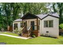 Quaint bungalow showcasing fresh landscaping, stylish brick work, and a welcoming front entrance at 345 Adelle Se St, Atlanta, GA 30315
