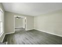 Inviting living area with gray flooring and neutral wall paint at 3180 S Elizabeth Dr, Douglasville, GA 30135