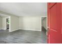 Spacious living room with gray floors and fresh, neutral paint at 3180 S Elizabeth Dr, Douglasville, GA 30135