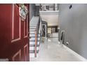 Elegant entryway with marble floors, staircase, and an open view to the living area at 2780 Lakeview Walk, Decatur, GA 30035