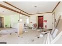 Spacious living room undergoing renovation, showcasing exposed beams and abundant natural light at 2522 Frost Sw Dr, Marietta, GA 30008