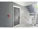 Exterior door with house number next to a stairwell at 5207 Santa Fe Pkwy, Sandy Springs, GA 30350