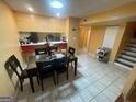 The dining area features a tile floor, a bar and stairs to a second level at 2009 Oak Park Ln, Decatur, GA 30032