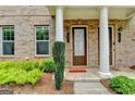 Front entrance of the townhome with a festive 