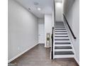 Entryway featuring hardwood floors and stairs leading to the second level at 711 Topsail Ln, Alpharetta, GA 30005