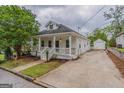 Charming home with long driveway and detached garage at 1555 New Ne St, Atlanta, GA 30307