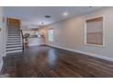 Open-concept living room with hardwood floors and lots of natural light at 1555 New Ne St, Atlanta, GA 30307