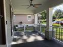 Inviting covered front porch with ceiling fan and black railing, great for relaxing and enjoying the outdoors at 2148 M L King Jr Sw Dr, Atlanta, GA 30310