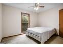 Neutral bedroom with ceiling fan and natural light at 1587 Cronic Town Rd, Auburn, GA 30011