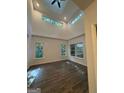 Bright, open living room with vaulted ceiling, modern ceiling fan, and sleek floors at 101 Dancing Fox Rd, Decatur, GA 30032