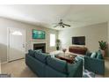 Bright living room with a fireplace, tv, modern furniture, and neutral paint, creating an inviting space at 260 Redding Rdg, Atlanta, GA 30349