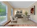 Inviting office with neutral walls, wood flooring, and ample natural light for a productive workspace at 3355 Golfe Links Dr, Snellville, GA 30039