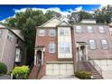 Beautiful brick townhome with a two-car garage, traditional architecture, and welcoming entrance at 2084 Cobblestone Ne Cir, Brookhaven, GA 30319