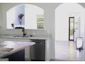 Modern kitchen with marble countertops, stainless steel appliances, and eat-in bar at 6127 Landers Loop, Fairburn, GA 30213