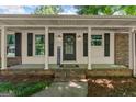 Inviting front porch with classic columns and a welcoming entrance, perfect for relaxing at 2826 Summit Ridge Dr, Marietta, GA 30066