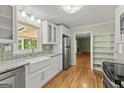 Bright kitchen with stainless steel appliances, white cabinetry, and granite countertops, ready for cooking at 2826 Summit Ridge Dr, Marietta, GA 30066