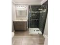 Modern bathroom with a tiled shower and vanity at 2410 Thrasher Rd, Buford, GA 30519
