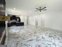 Open-concept living room with views into the kitchen and other rooms at 243 Roxbury Dr, Riverdale, GA 30274