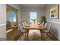 Formal dining room with a large wooden table, seating for eight, and bright natural light at 1105 Buckhurst Dr, Atlanta, GA 30349
