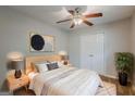Comfortable bedroom with a ceiling fan, closet, and stylish decor at 2245 Dauphine St, Atlanta, GA 30344